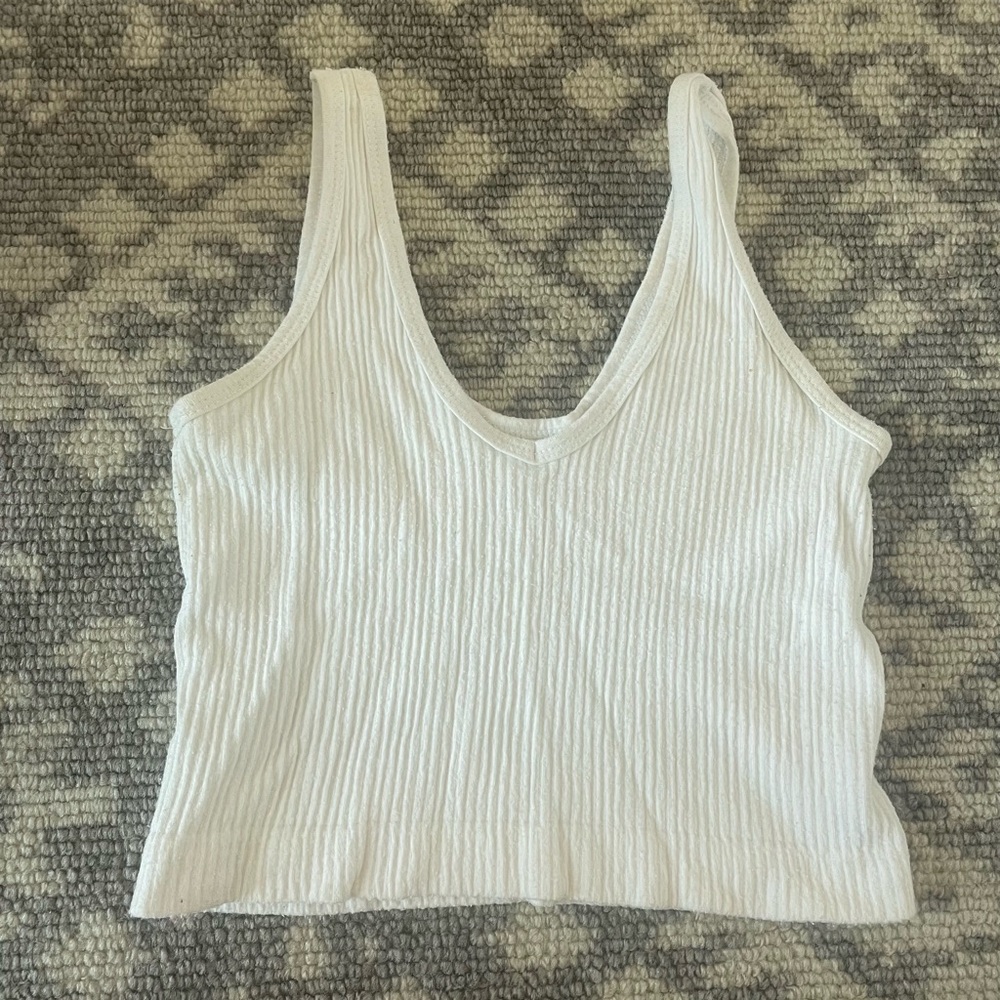 Urban Outfitters out from under tank in white
